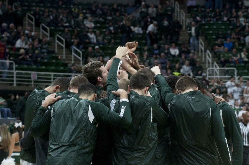 The Spartans huddle together before the first half of the game against Nebraska on Jan. 20, 2016 at Breslin Center. The Spartans were defeated by the Cornhuskers, 72-71.