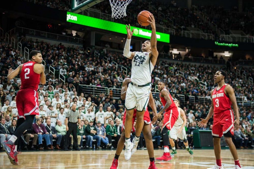Freshman guard and forward Miles Bridges (22) shoots the ball during the first half of the men's basketball game against Ohio State on Feb. 14, 2017 at Breslin Center. The Spartans are up, 40-34. 