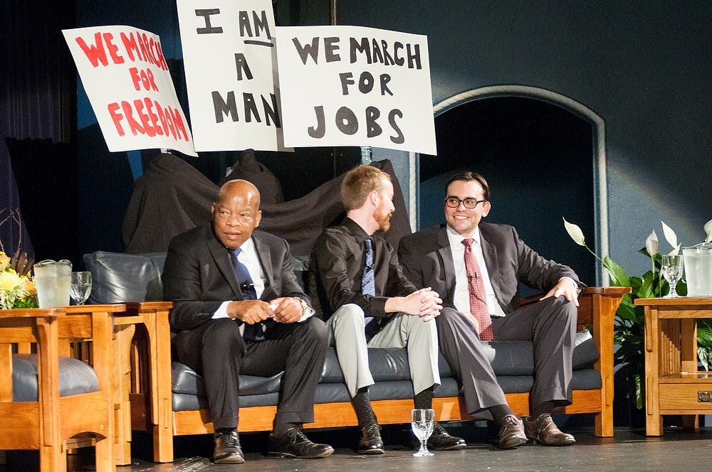 <p>From left, congressman John Lewis, D-Ga., illustrator Nate Powell, and author Andrew Aydin discuss the book, "March: Book One" during the One Book One Community event Aug. 25, 2014, at Hannah Community Center. "March: Book One" is the first in a series of graphic novels telling Lewis' personal story and journey through the civil rights movement. Raymond Williams/The State News</p>