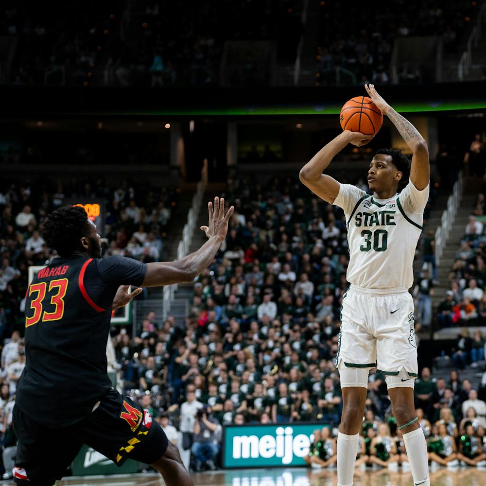 <p>Senior forward Marcus Bingham, Jr.  (30) takes a shot. MSU beat Maryland 77-67 in their last regular-season game at the Breslin Center on March 6, 2022.</p>
