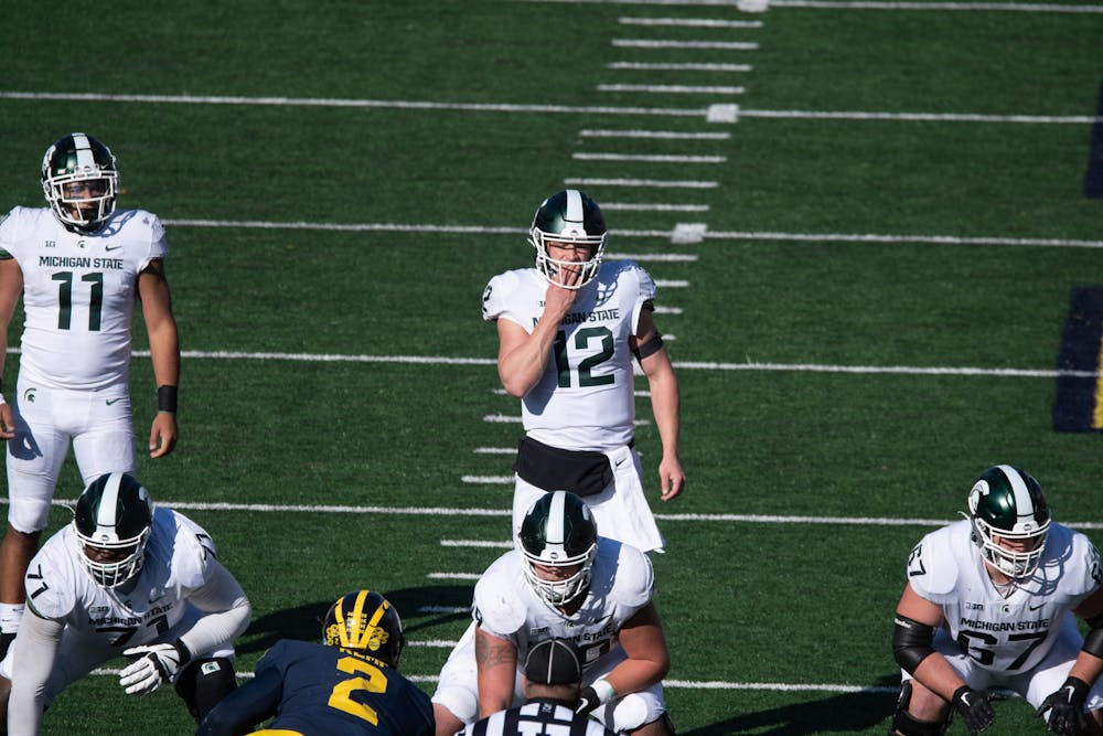 Quarterback Rocky Lombardi prepares for a play against U of M on Oct. 31, 2020.