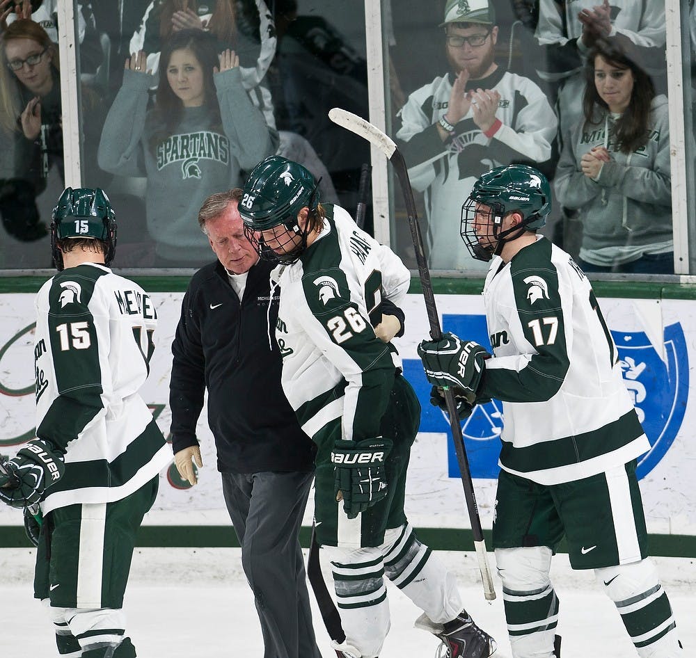 	<p>Fans cheer on freshman forward Villiam Haag as he walks off the ice after taking a hit Jan. 18, 2014, at Munn Ice Arena during the game against Penn State. The Spartans defeated the Nittany Lions  for the second night in a row 3-1.</p>