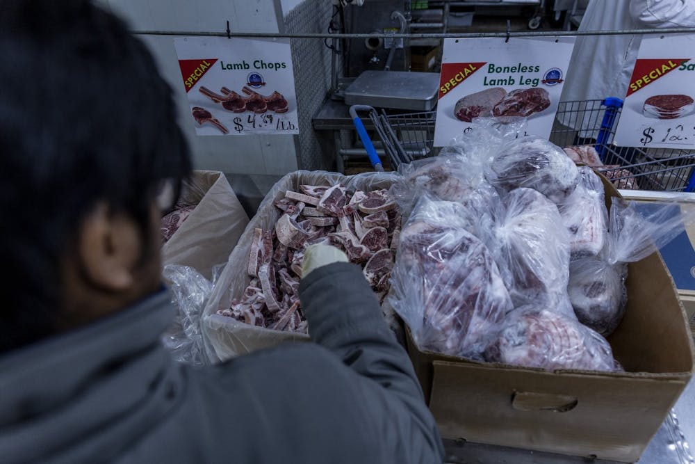 Zafri Halim packs away lamb chops on Nov. 24, 2019 at Al Saad Market in Detroit, Mich. 