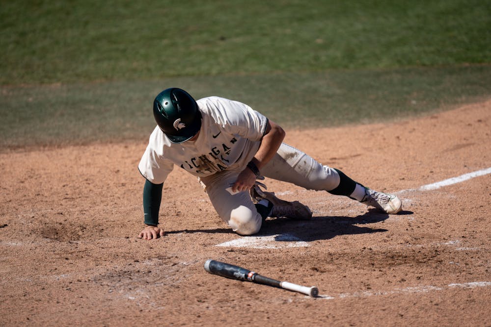 Not quite yet for MSU. Sophmore Trent Farquhar slides into home plate befor realizing he's out. MSU would later win the first game against Houston Baptist 1-0 on March 20, 2022.