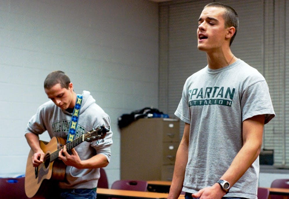 Mechanical engineering freshman Ben Allen strums the guitar as kinesiology freshman Aaron Wilson sings a self-written song on Wednesday night at Wonders Hall. Allen and Wilson were participating in Spartan Idol which is hosted by the University Activities Board. Anthony Thibodeau/The State News