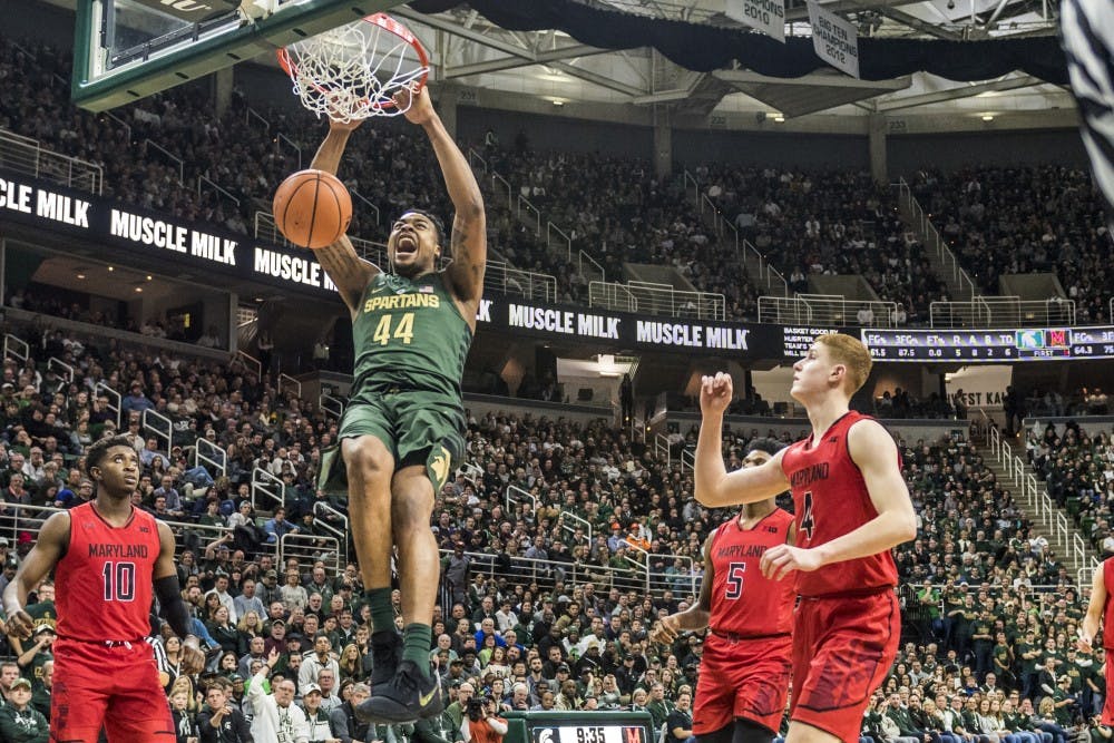<p>Sophomore forward Nick Ward (44) dunks the ball during the men's basketball game against Maryland on Jan. 4, 2018 at Breslin Center.</p>