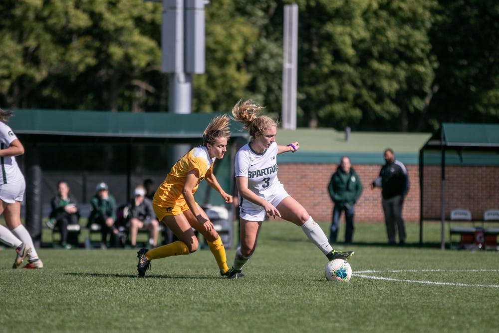 <p>Junior midfielder Danielle Stephan (3) dribbles around a defender during the game against Iowa Oct. 6, 2019. The Spartans fell to the Hawkeyes, 3-0.</p>