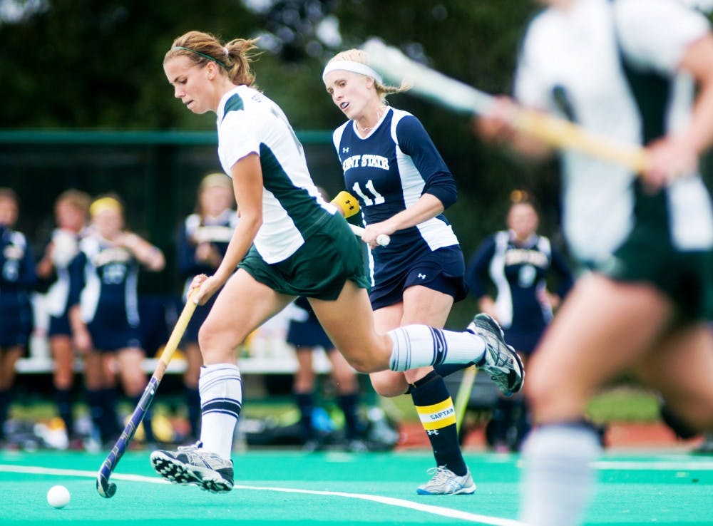 Freshman midfielder Becky Stiles maintains possession of the ball against Kent State back Carla Johl during Sunday?s game at Ralph Young Field. Stiles scored the second goal of the game, bringing the Spartans to victory over the Golden Flashes. Lauren Wood/The State News