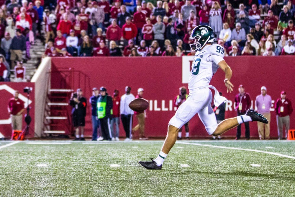 <p>Freshman punter Bryce Baringer (99) punts during the game against Indiana on Sept. 22, 2018 at Memorial Stadium. The Spartans defeated the Hoosiers, 35-21.</p>