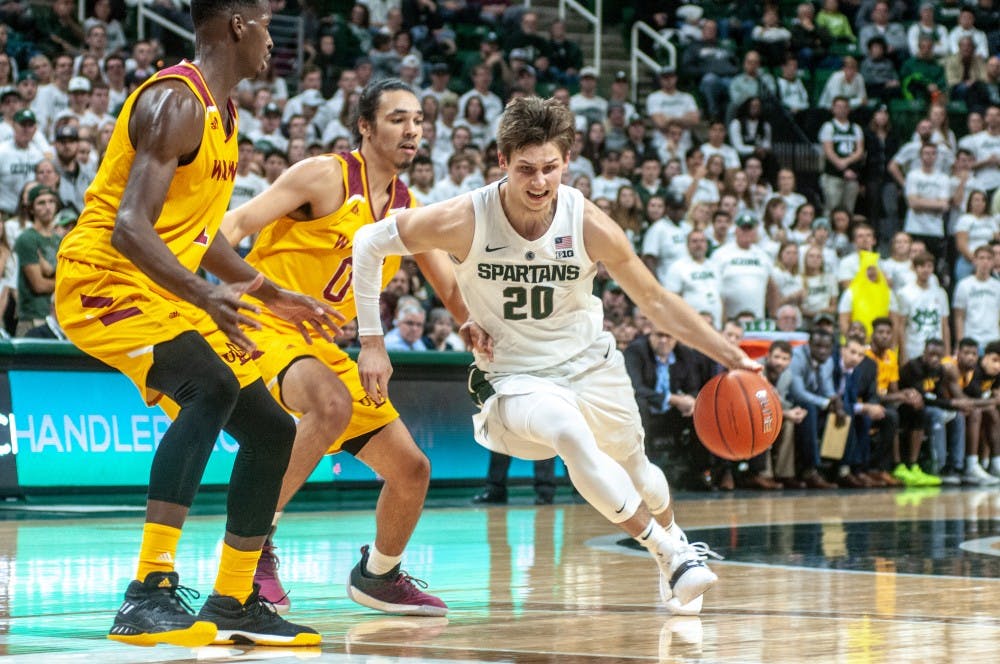 Senior guard Matt McQuaid (20) prepares to shoot during the game against University of Louisiana-Monroe at Breslin Center on Nov. 14, 2018. The Spartans defeated the Warhawks, 80-59.