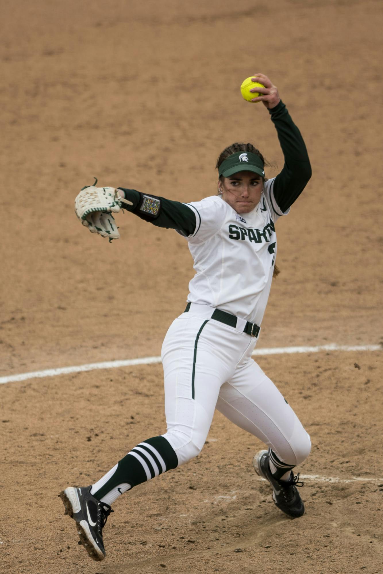 Sophomore pitcher Sarah Ladd (20) throws a pitch during the game against Rutgers on March 28, 2021, at Secchia Stadium. The Spartans defeated the Scarlet Knights 4-1.