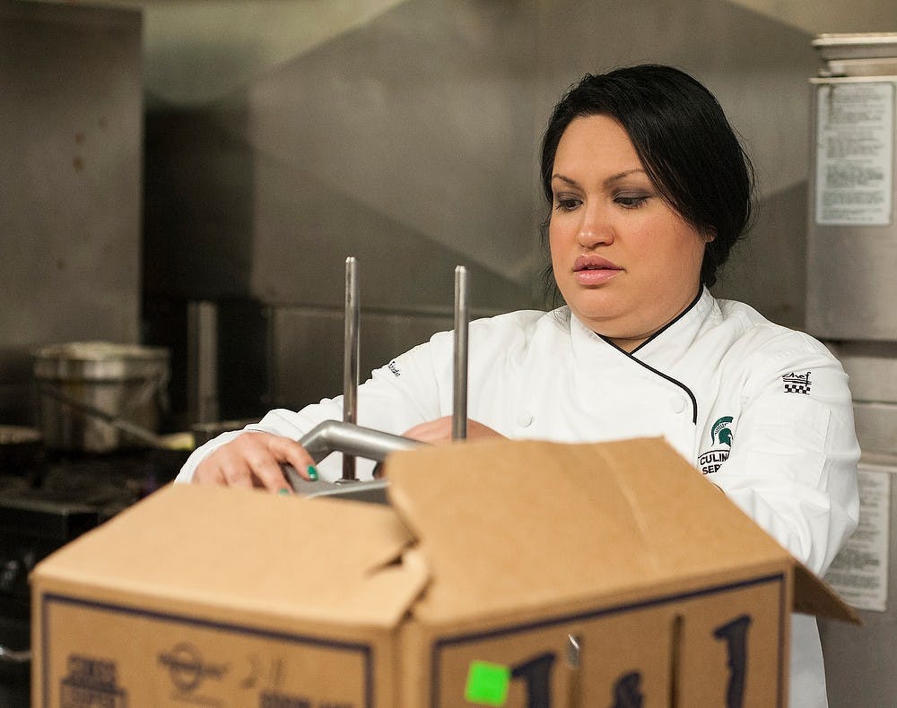 <p>Sous Chef Melissa Martinez helps out in the kitchen Feb. 12, 2015, at The Gallery at Snyder-Phillips Hall. Martinez oversees the staff and kitchen and makes sure everything runs smoothly. Hannah Levy/The State News</p>