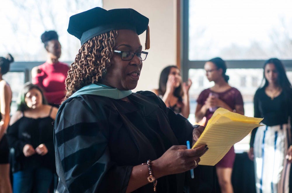 <p>Upward Bound Director and Program Coordinator Dr. Stephanie Anthony lines up the honorees for a processional to start the reception on April 30, 2018 at the MSU Union Ballroom. The Upward Bound program helps prepare seniors to become first-generation college students.</p>