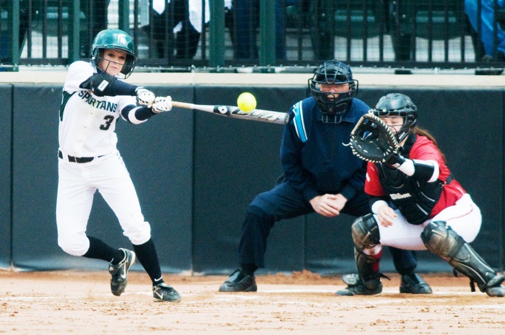 Sophomore outfielder Kylene Hopkins swings the bat to hit the ball during Saturday's game against Wisconsin at Secchia Stadium. The Spartans defeated the Badgers, 8-0, in the fifth inning. Lauren Wood/The State News