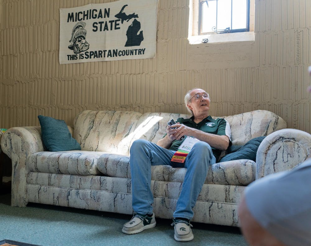 <p>MSU alum Mark White sits on a couch in Jon Jehrer's office in Beaumont Tower during a tour for the Spartan Reunion in East Lansing, Mich., on May 28, 2026.</p>