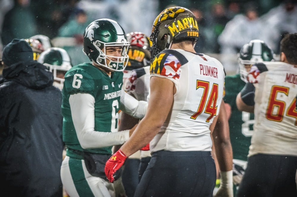 <p>Senior quarterback Damion Terry (6) shakes hands with Maryland &nbsp;offensive lineman Brian Plummer (74) after the game against Maryland on Nov. 18, 2017, at Spartan Stadium. The Spartans defeated the Terrapins, 17-7.</p>