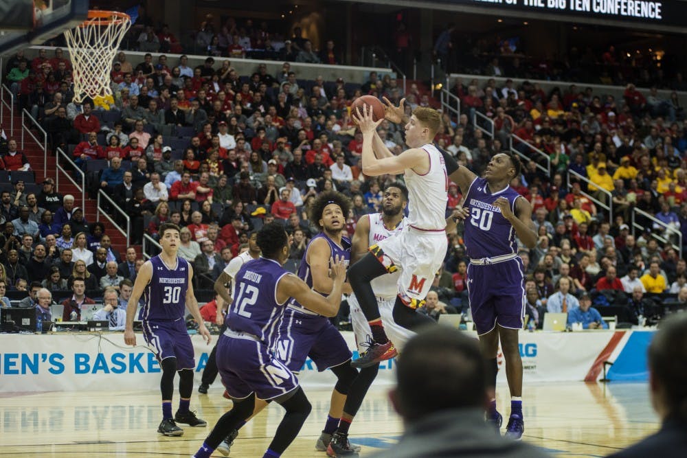 Freshman guard Kevin Hurter (4) jumps to shoot the ball during the first half of the game against Northwestern in the third round of the Big Ten Tournament on March 10, 2017 at Verizon Center in Washington D.C. 