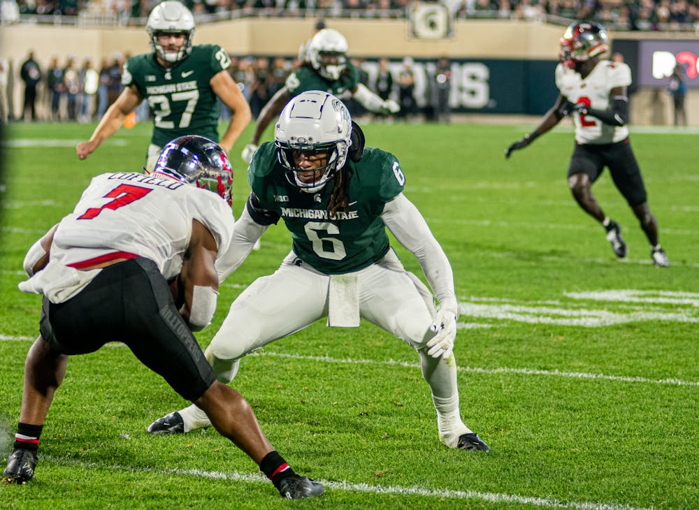 <p>Junior linebacker Quavaris Crouch meets the receiver at the line of scrimmage during the Spartans&#x27; 48-31 homecoming win against Western Kentucky on Oct. 2, 2021.</p>