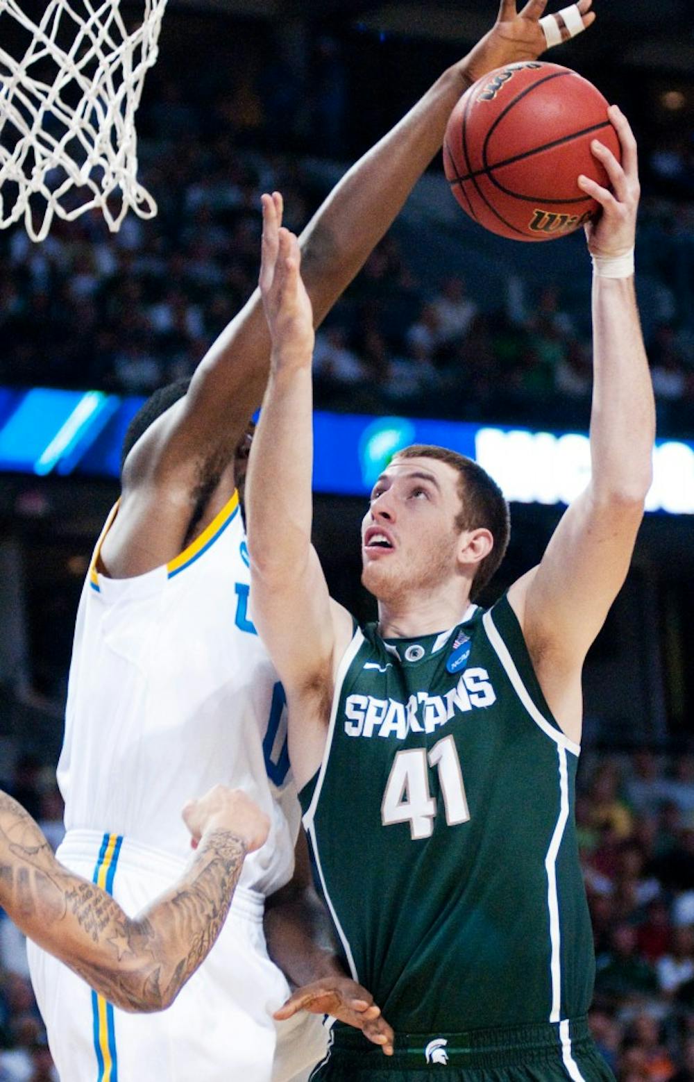Sophomore center Garrick Sherman is blocked by UCLA center Antthony Stover during the first half. The Spartans lost to the Bruins, 78-76, in the second round of the 2011 NCAA Division 1 Men's Basketball Championship on Thursday night at St. Pete Times Forum in Tampa, Fla. Josh Radtke/The State News