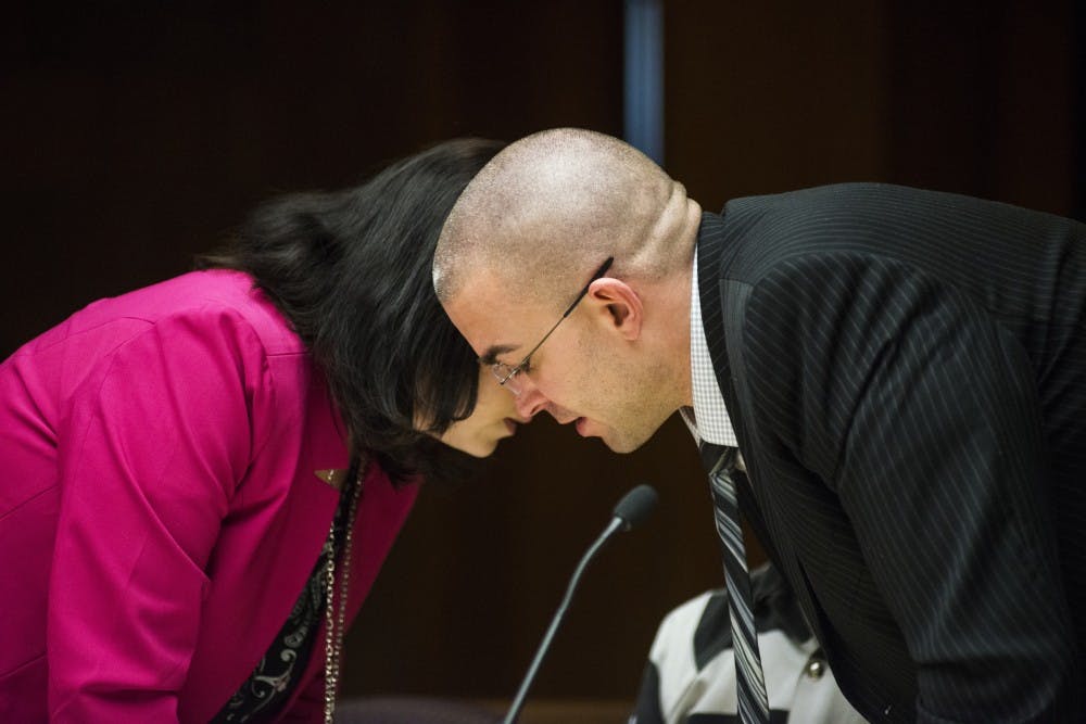 Defense attorney Shannon Smith, left, and defense attorney Matt Newbury converse during the preliminary examination on Feb. 17, 2017 at 55th District Court in Mason, Mich. The preliminary examination occurred as a result of former MSU employee Larry Nassar's alleged sexual abuse.