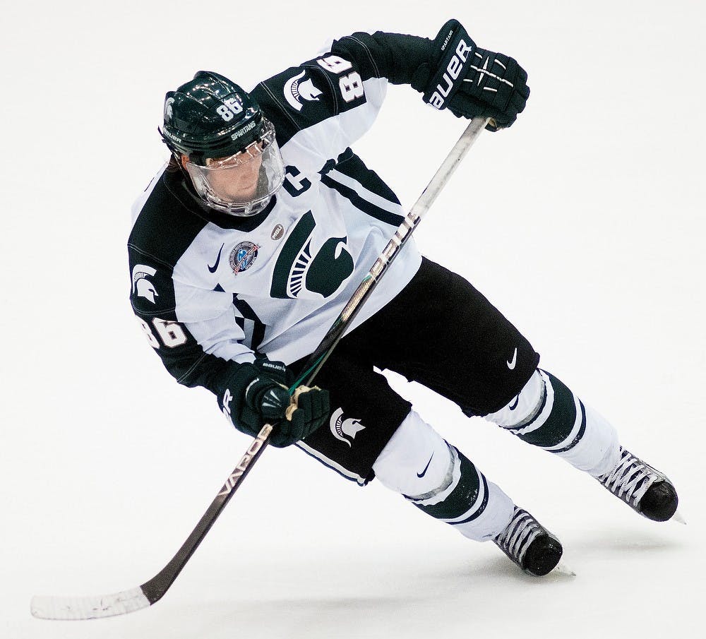 Junior forward Greg Wolfe skates on the ice in the game against Niagara on Saturday evening, Oct. 20, 2012, at Munn Ice Arena. The Spartans tied the Purple Eagles 3-3. Natalie Kolb/The State News