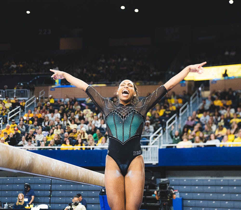 MSU junior all-around MaKayla Tucker celebrates after her balance beam routine at the Crisler Center in Ann Arbor, MI, on Feb. 01, 2026.
