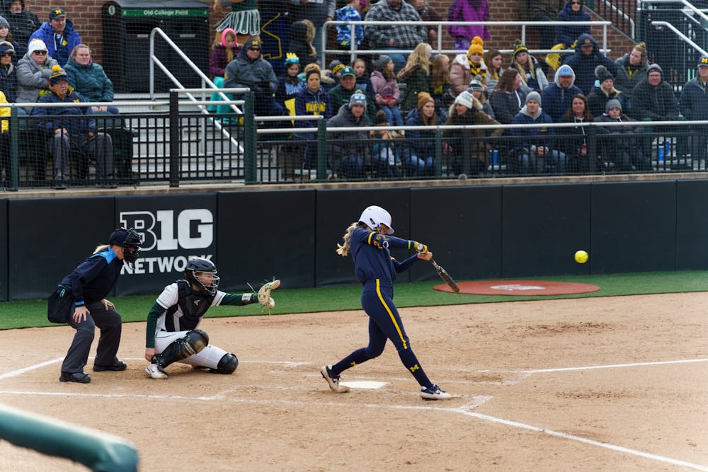 <p>Michigan freshman Ellie Sieler (1) hits a double to left-center in the top of the third. Michigan State lost 3-0 to Michigan at the Secchia Stadium, on April 19, 2022.</p>