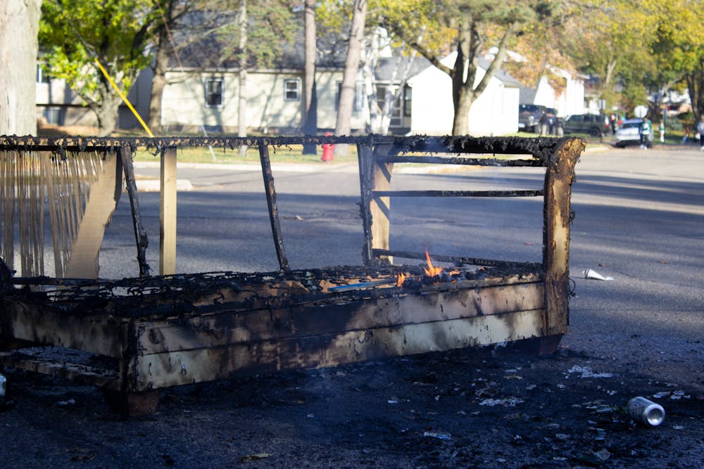 A burning couch on the corner of Frye Avenue and Stoddard Avenue. 