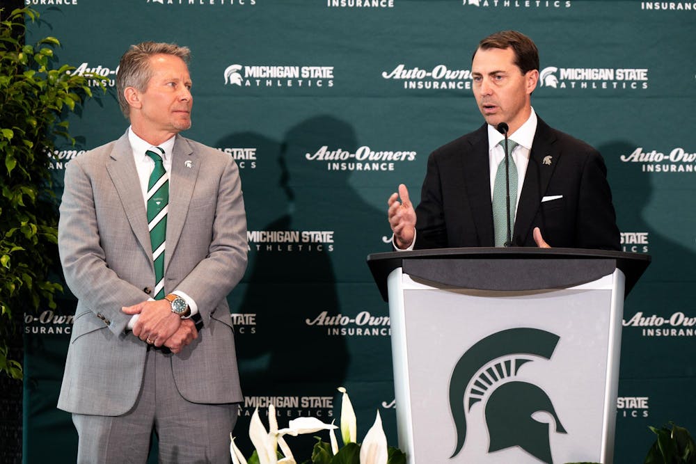 Michigan State University president Kevin Guskiewicz and new vice president and athletic director J. Batt speak during Batt's welcome ceremony in East Lansing, Michigan on June 4, 2025.