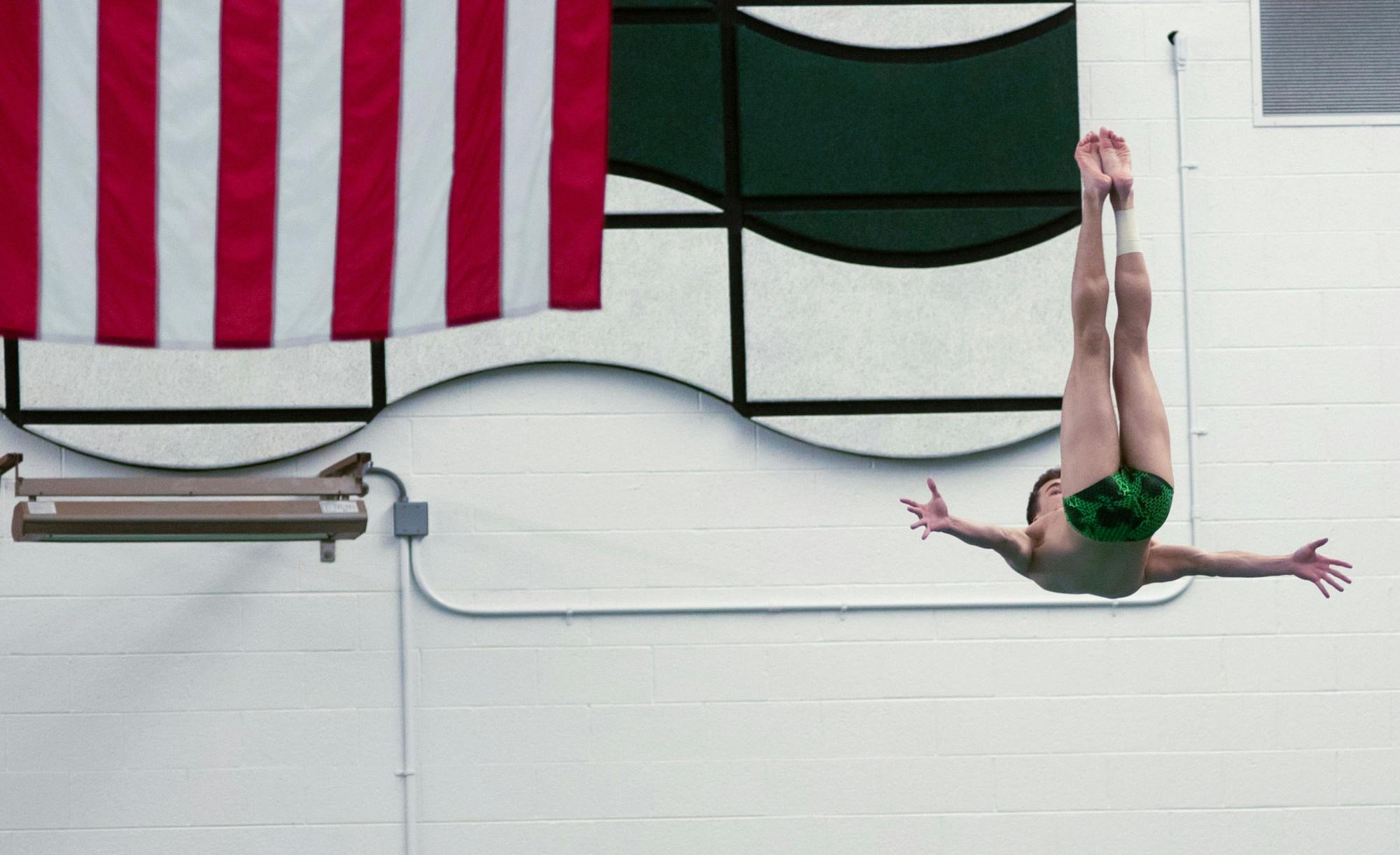 Then-sophomore Jakob Heberling performs multiple flips off of the three-meter board. Michigan State hosted the swim and dive meet against Oakland on Jan. 18, 2020.