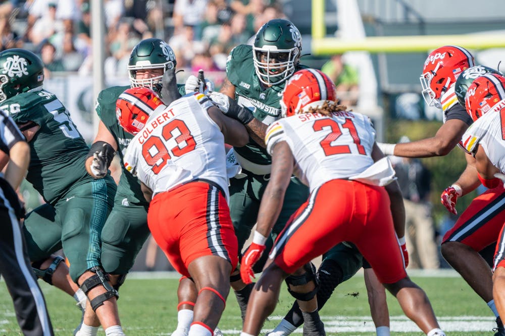<p>Michigan State players about to tackle Maryland players during the game at Spartan Stadium on Sept. 23, 2023. The Spartans ultimately lost to the Terrapins 31-9.</p>