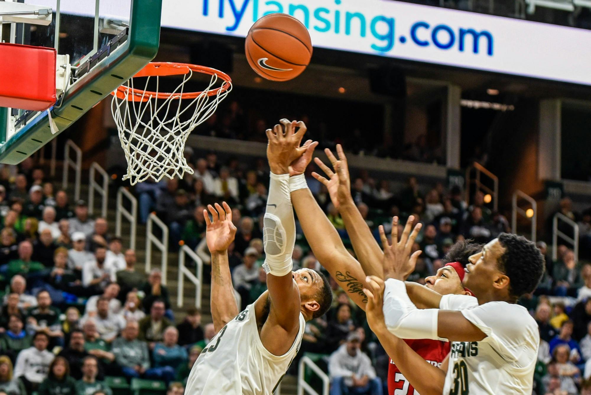 Sophomore forward Marcus Bingham Jr. (30) tries to shoot during the game against Rutgers at Breslin Center on Dec. 8, 2019. The Spartans defeated the Scarlett Knights, 77-65.