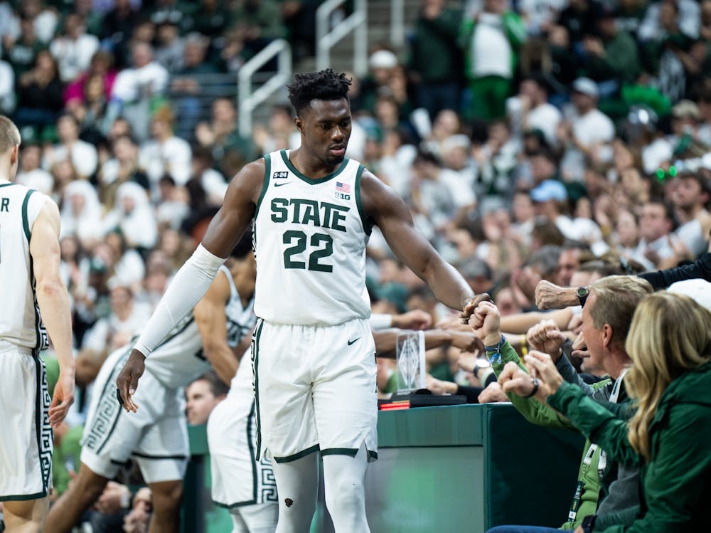 Junior center Mady Sissoko (22) fist pumps fans during a game against Villanova at the Breslin Center on Nov. 18, 2022. The Spartans defeated the Wildcats 73-71. 