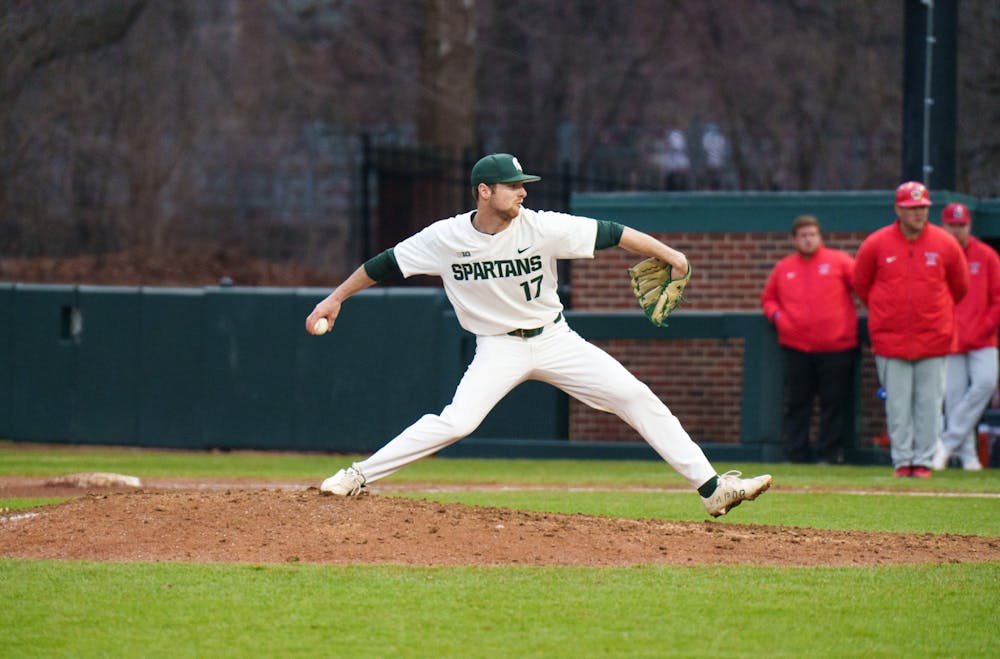 <p>Michigan State junior Andrew Carson pitching against Youngtown State at McLane Baseball Stadium on March 30, 2022. Spartans are victorious 12-5 against Youngtown State.</p>