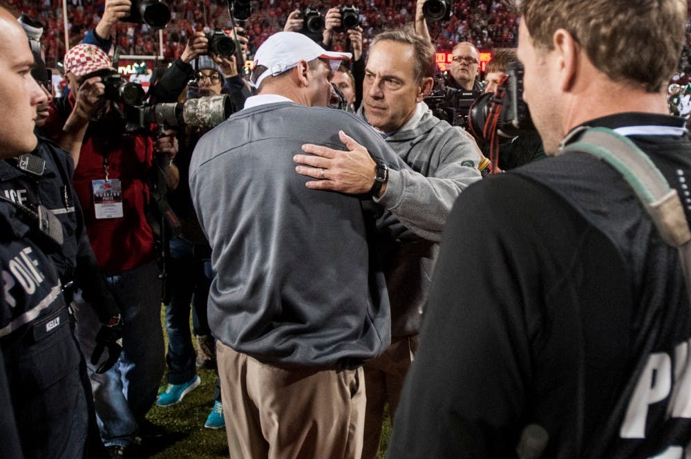 	<p>Head coach Mark Dantonio and Nebraska head coach Bo Pelini shake hands after the game against Nebraska on Nov. 16, 2013, at Memorial Stadium in Lincoln, Neb. The Spartans defeated the Cornhuskers, 41-28. Khoa Nguyen/The State News</p>