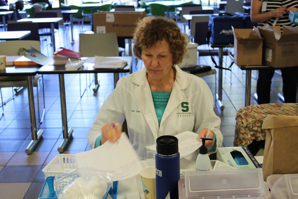 <p>Catherine “Kate” Lein, an assistant professor in MSU's nursing program at one of the OISS’s annual Halloween vaccination clinics.</p>