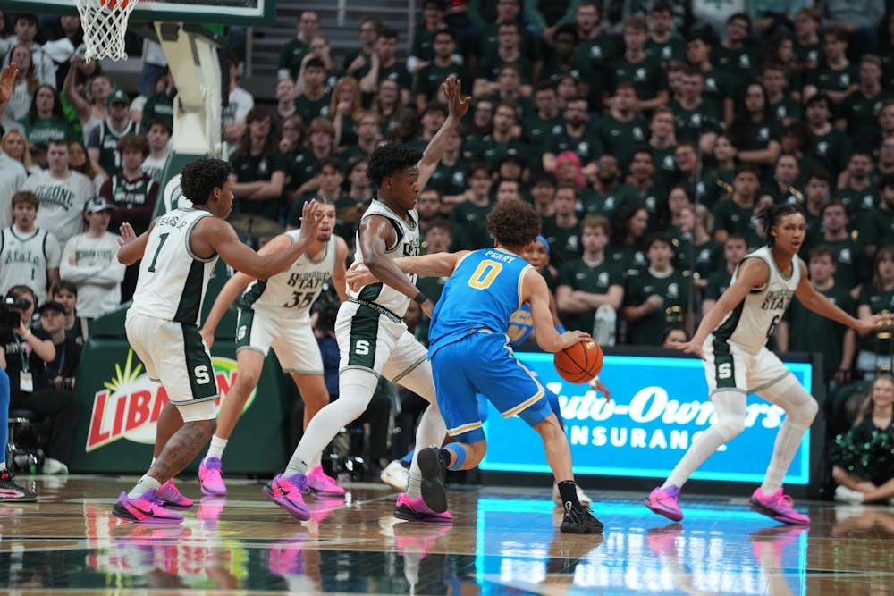 Michigan State plays defense against UCLA at the Breslin Center in East Lansing, Michigan, on Tuesday, Feb. 17, 2026.