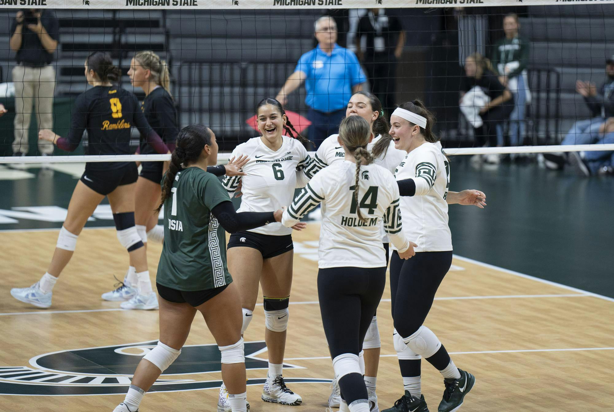 <p>MSU volleyball players celebrate after scoring against Loyola Chicago during their game at the Breslin Center on Sept. 8, 2024.</p>