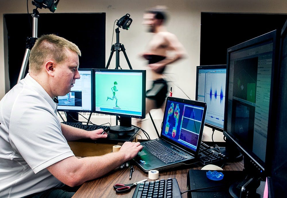 	<p>Graduate student Keith Button runs on a specialized track while research assistant Jerrod Braman records data Thursday at Fee Hall. Button and Braman were testing equipment in preparation for <span class="caps">MSU</span>&#8217;s upcoming Science Festival running April 12-21. </p>