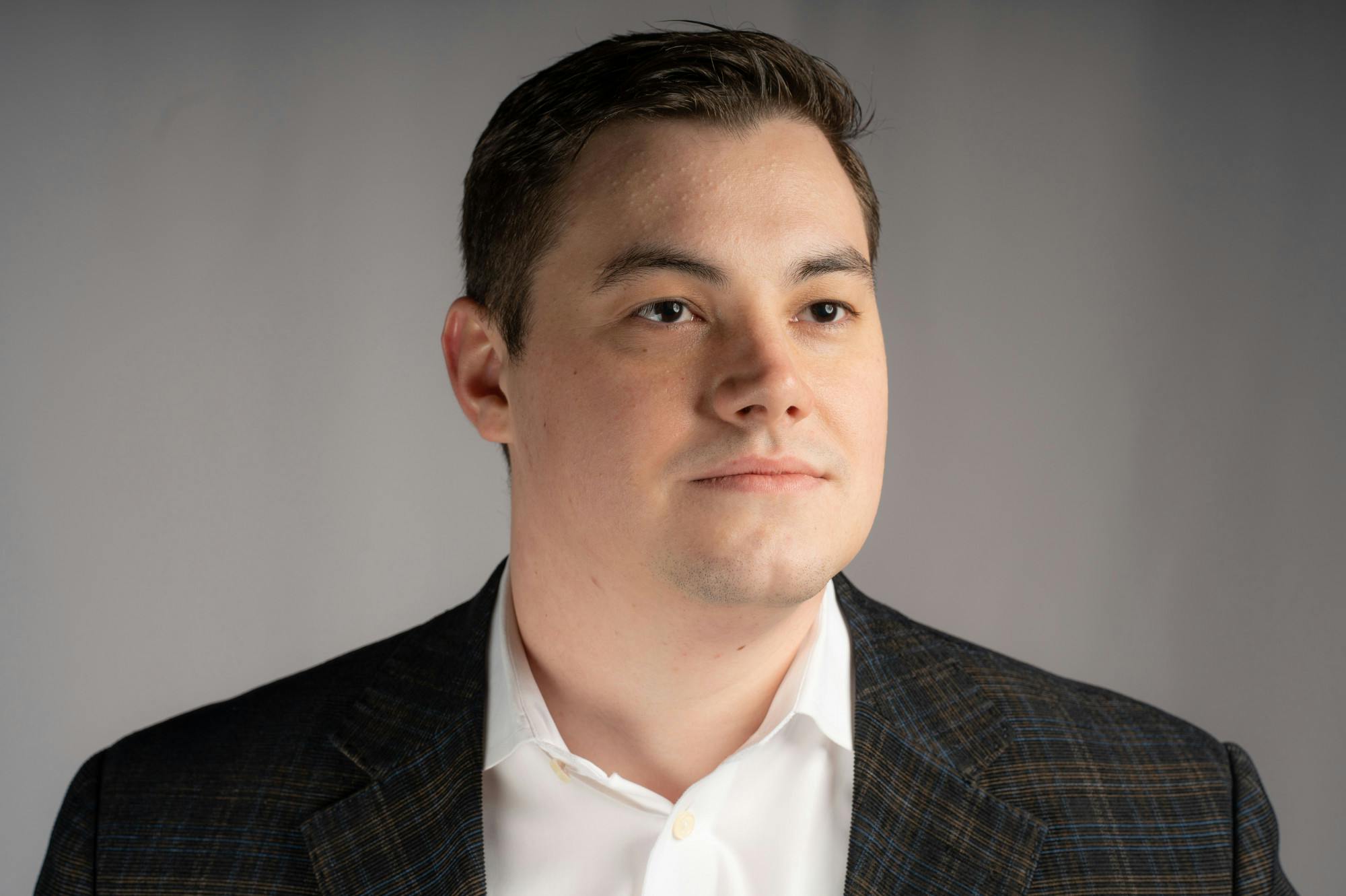 <p>Logan Byrne, Michigan State University graduate and candidate for the 77th House District seat, poses for a portrait on Jan. 25. <br/><br/></p>