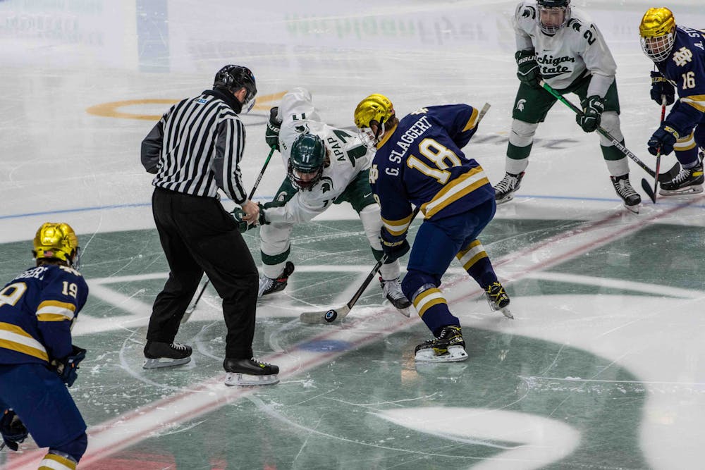 Senior Tommy Apap (11) faces off against a Notre Dame player in the second period. The Fighting Irish shutout the Spartans 2-0 on Feb. 27, 2021.