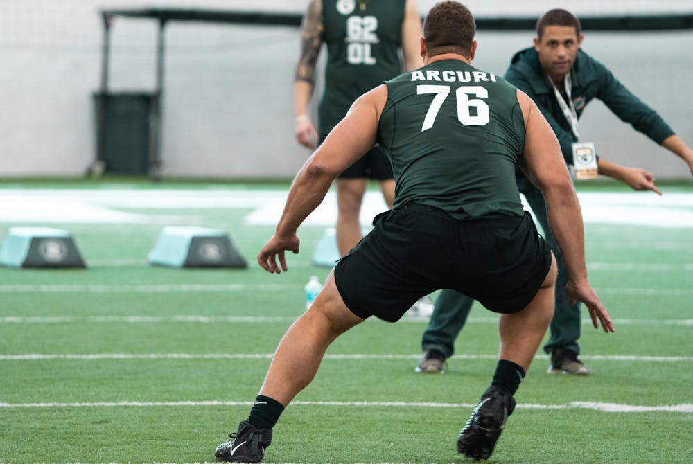 <p>Michigan State graduate student AJ Arcuri taking off during Pro Day on-field position drills, on Mar. 16, 2022 at the Duffy Daugherty Indoor Football Building.</p>