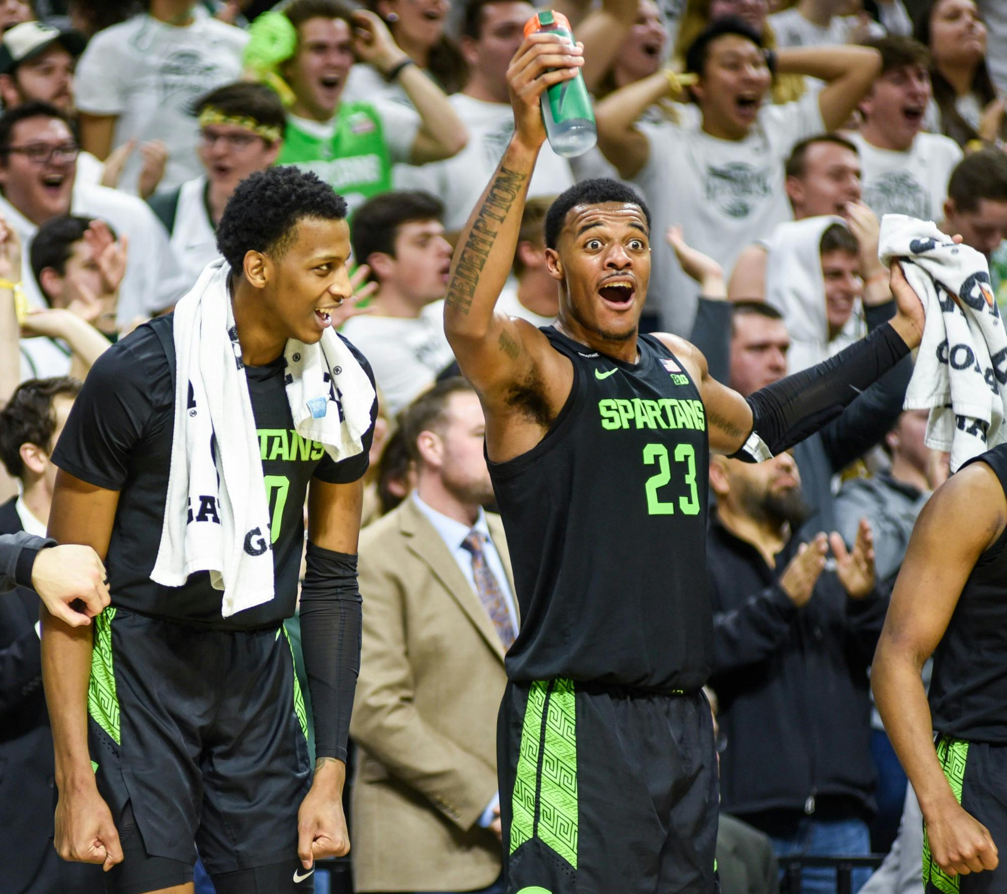 <p>Sophomore forward Marcus Bingham Jr. (30), left, and junior forward Xavier Tillman (23), right, celebrate sophomore forward Gabe Brown’s (44) dunk during the game against Wisconsin at the Breslin Center on Jan. 17. The Spartans defeated the Badgers, 67-55.</p>