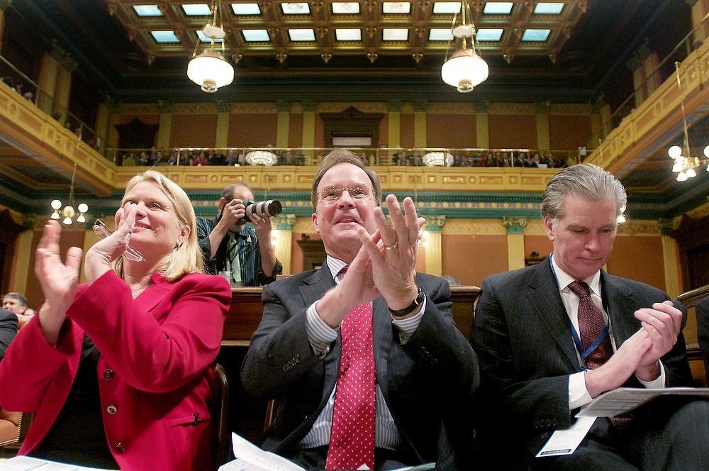 	<p>Secretary of State Ruth Johnson, State Attorney General Bill Schuette, and State Treasurer Andy Dillon applaud as Gov. Snyder addresses the state of Michigan on Wednesday, Jan. 16, 2013, at the Capitol Building.  Snyder informed the state of Michigan on all of the improvements that have been made in the past year and his plans for the new year.  Katie Stiefel/The State News</p>