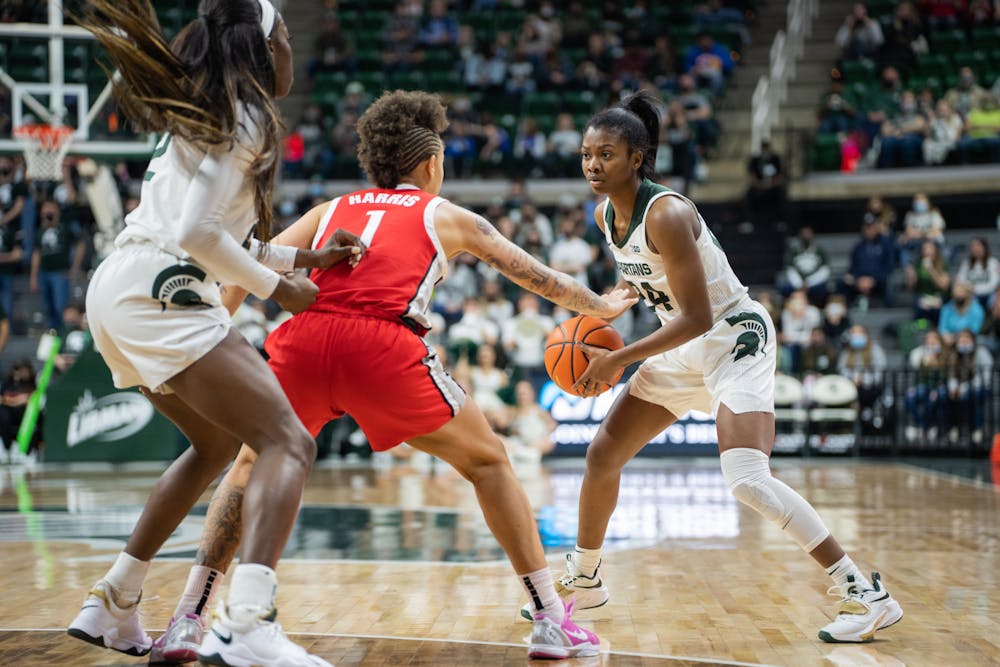 <p>Senior guard Nia Clouden (24) takes on a defender. The Spartans lost 61-55 against Ohio State University at the Breslin Center on Feb. 27, 2022.</p>