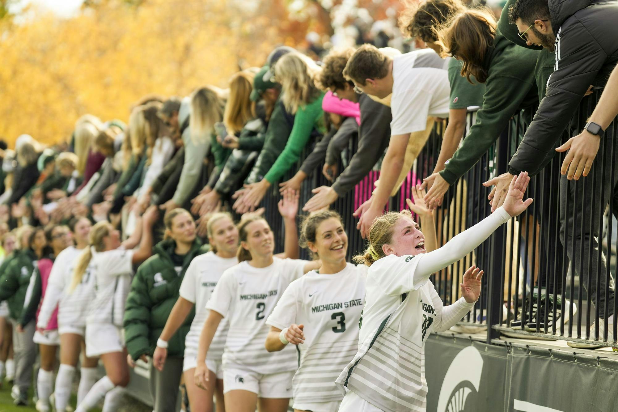 <p>The Michigan State women's soccer players high five fans after beating Purdue 3-1 at DeMartin Stadium on Oct. 27, 2024.</p>