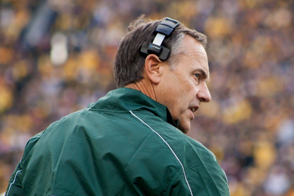 <p>Head coach Mark Dantonio walks off the field during the game against Michigan on Oct. 20, 2012 at Michigan Stadium in Ann Arbor, Mich. </p>