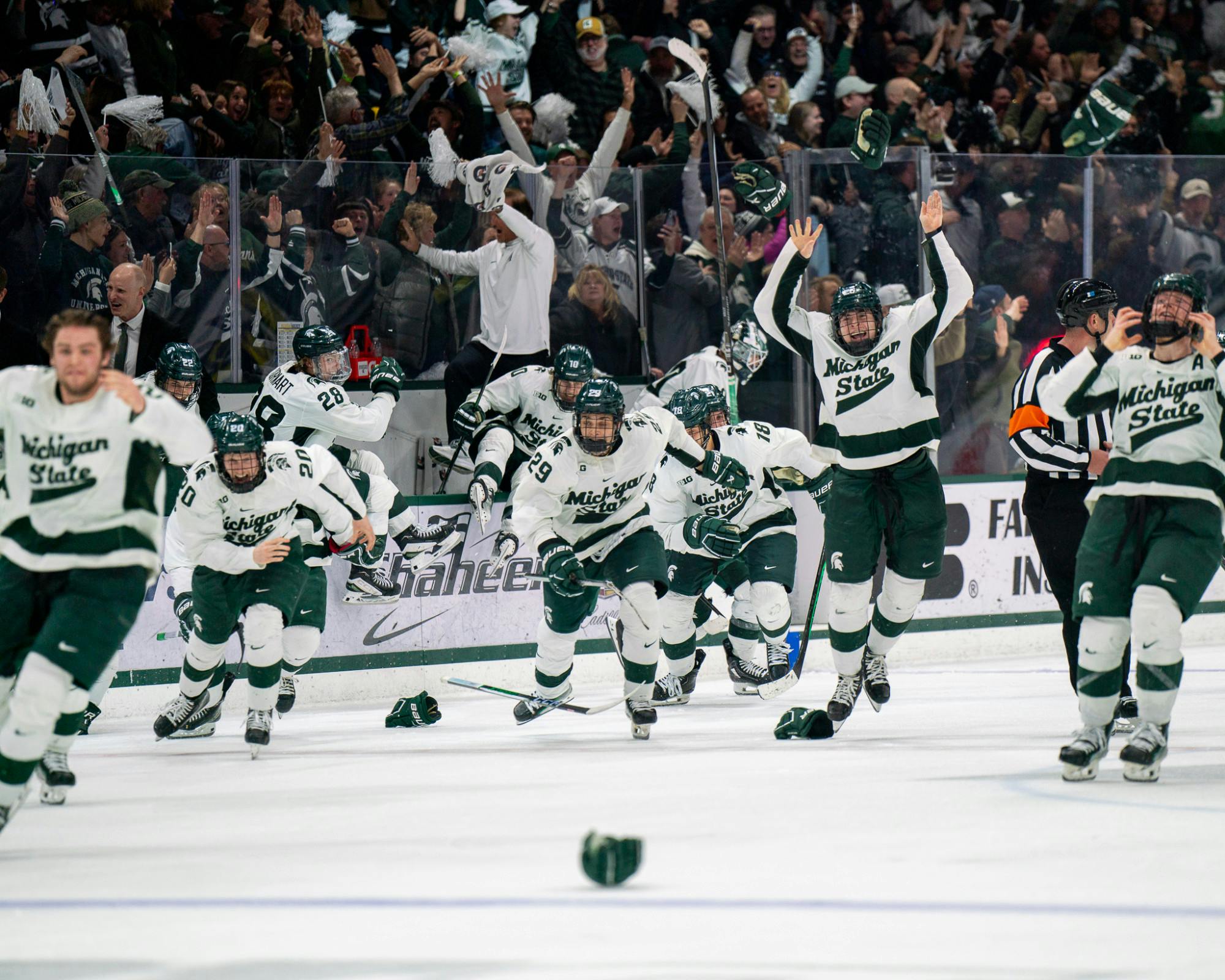 <p>The Spartans celebrate the game winning goal from freshman defenseman Patrick Geary (2) during a game against University of Michigan at Munn Ice Arena on March 23, 2024. MSU secured the Big Ten Tournament championship with their win over the Wolverines.</p>