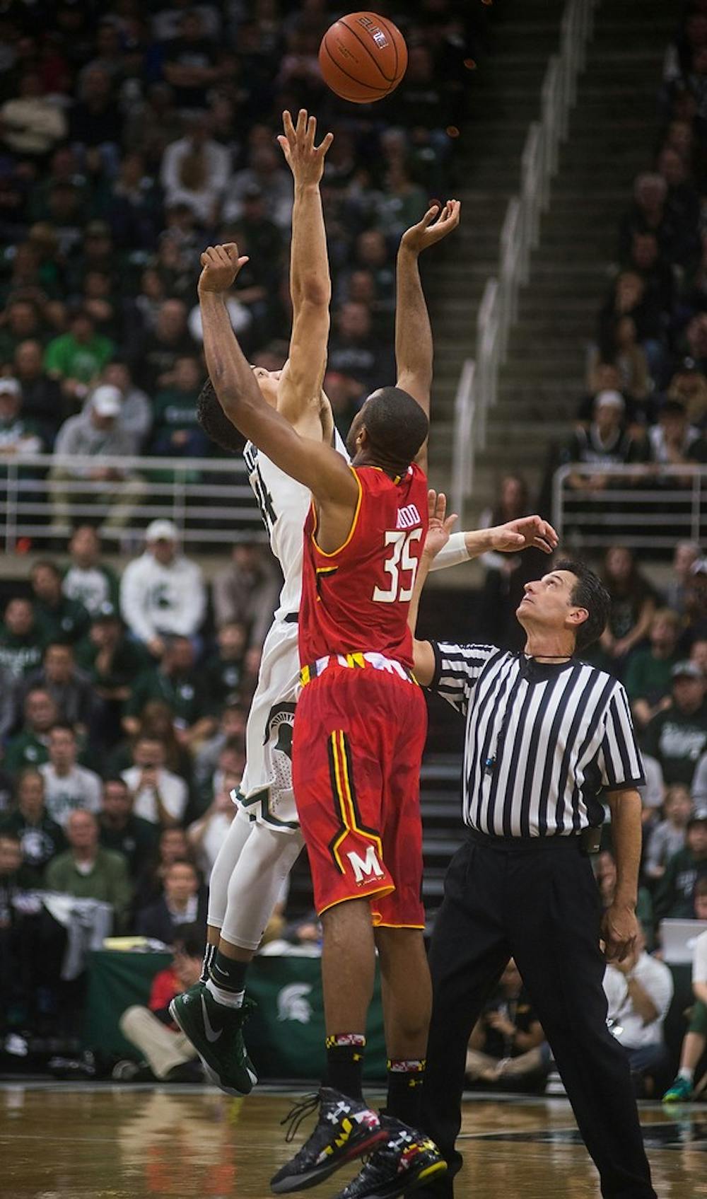 <p>Sophomore forward Gavin Schilling tips off against Maryland forward Damonte Dodd for overtime on Dec. 30, 2014, at Breslin Center. The Spartans were defeated by the Terrapins, 68-66 in double overtime. Danyelle Morrow/The State News</p>