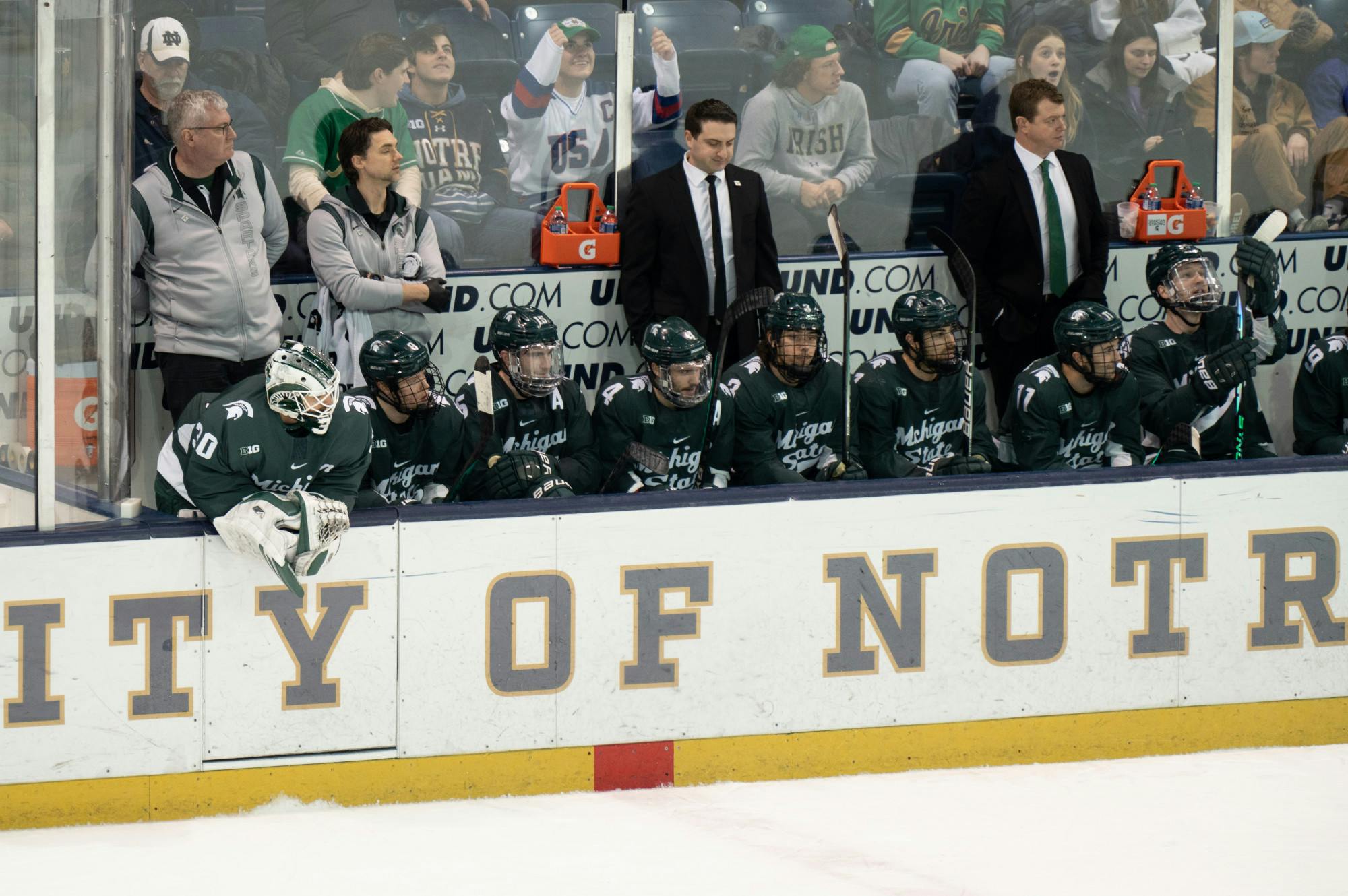 <p>MSU secondary junior goalie Jon Mor leans over the bench, watching the play at Compton Family Ice Arena in Notre Dame, IN on Friday, March 3, 2023. The Spartans fell 1-0 to Notre Dame in the Friday night matchup.</p>